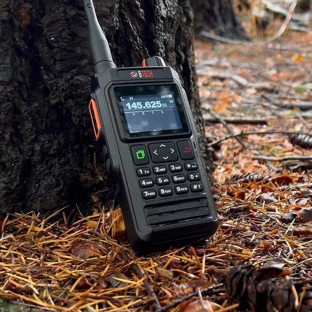 BTECH UV-PRO handheld radio outdoors beside a tree