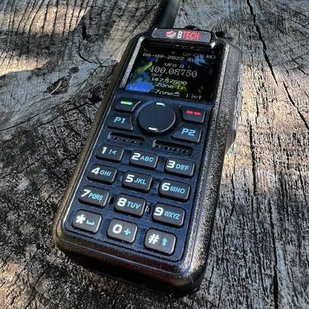 BTECH DA-7X2 digital and analog handheld radio on weathered wood