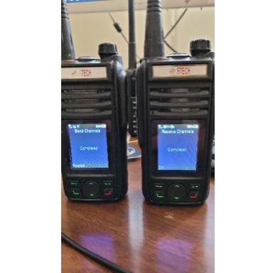 Two GMRS-PRO radios showing completed Send Channels and Receive Channels transfers
